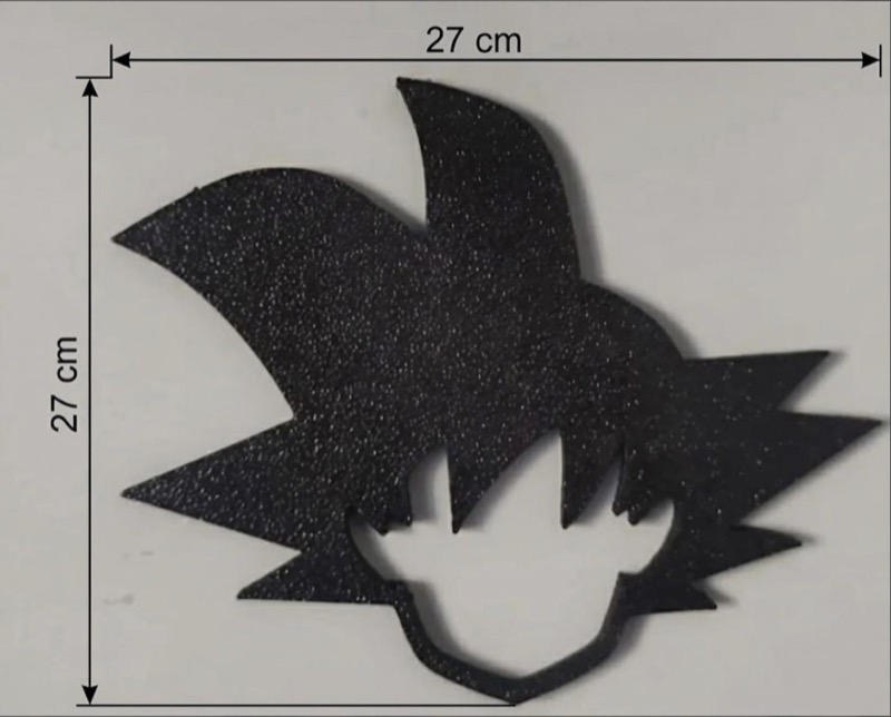 A black, glitter-textured silhouette of a character's spiky hair and face, measuring 27 cm by 27 cm.