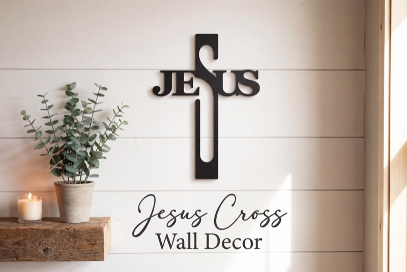 Black metal Jesus cross wall decor. The word "Jesus" is integrated into the cross design.