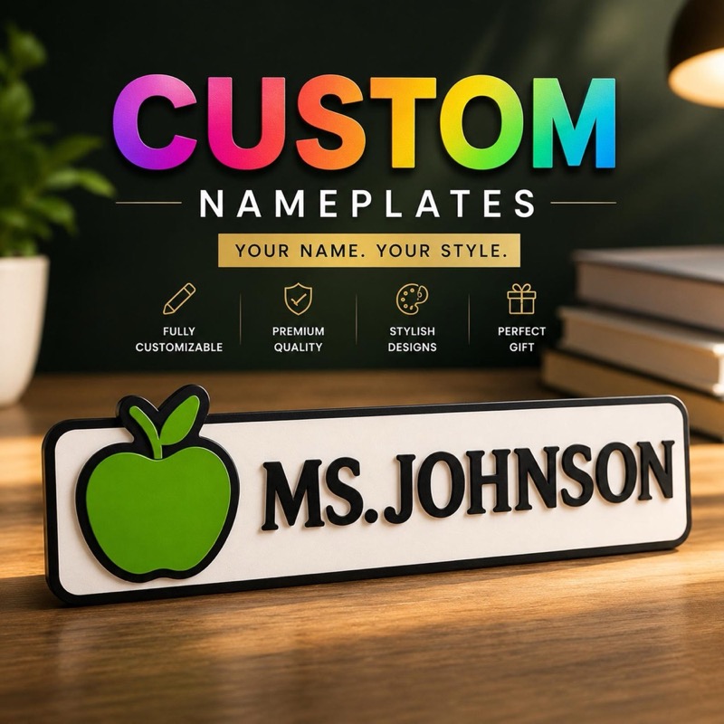 A rectangular desk nameplate with a white background and black border.